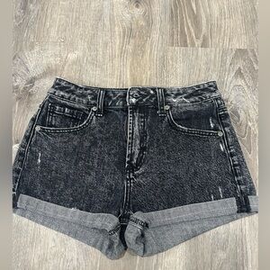Slightly distressed looking black/grey jean shorts.